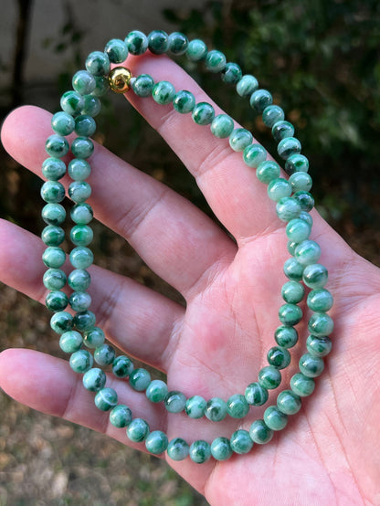 Soft glassy luster and fine crystalline texture of the 6.8mm authentic Myanmar jadeite bead necklace JN088