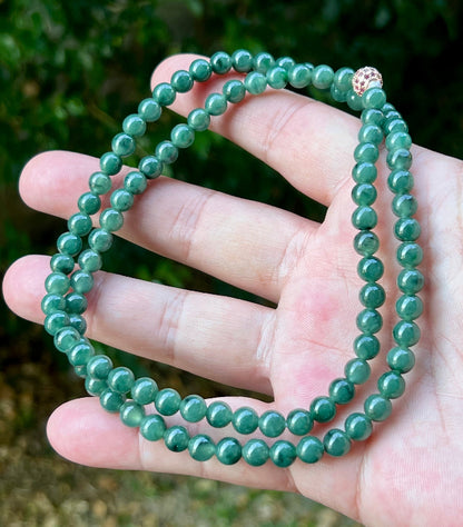 Soft glassy luster and fine crystalline texture of the 6.2mm authentic Myanmar jadeite bead necklace JN074