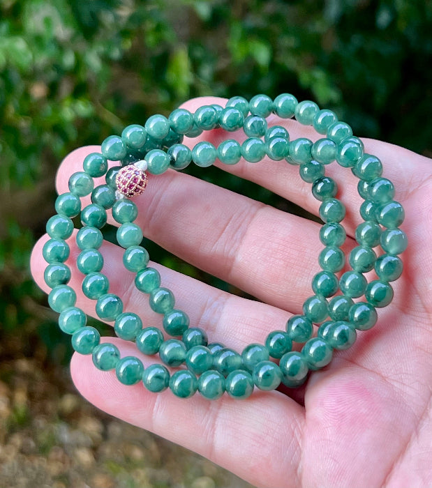 Soft glassy luster and fine crystalline texture of the 6.2mm authentic Myanmar jadeite bead necklace JN074