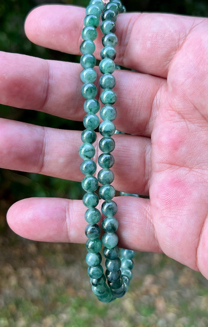 Soft glassy luster and fine crystalline texture of the 5.9mm authentic Myanmar jadeite bead necklace JN076