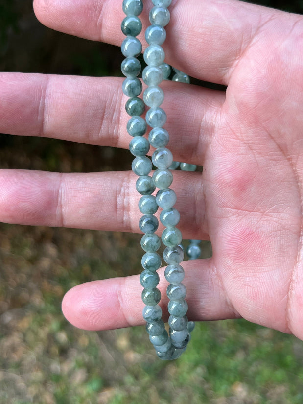 Soft glassy luster and fine crystalline texture of the 5.9mm authentic Myanmar jadeite bead necklace JN078