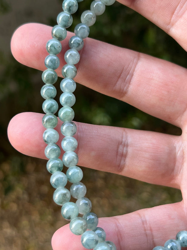 Soft glassy luster and fine crystalline texture of the 5.9mm authentic Myanmar jadeite bead necklace JN078
