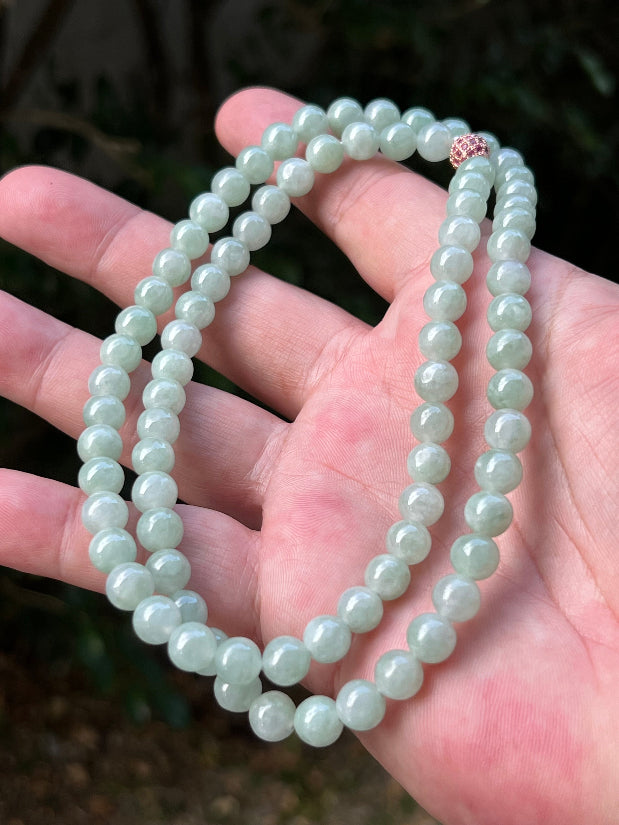 Soft glassy luster and fine crystalline texture of the 7.3mm authentic Myanmar jadeite bead necklace JN082