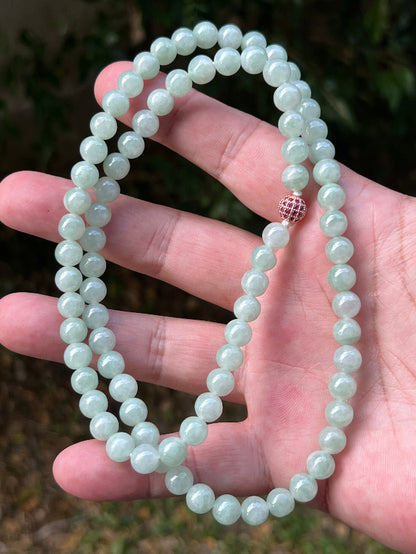 Soft glassy luster and fine crystalline texture of the 7.3mm authentic Myanmar jadeite bead necklace JN082