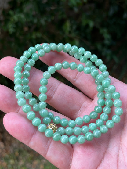 Soft glassy luster and fine crystalline texture of the 6mm authentic Myanmar jadeite bead necklace JN084