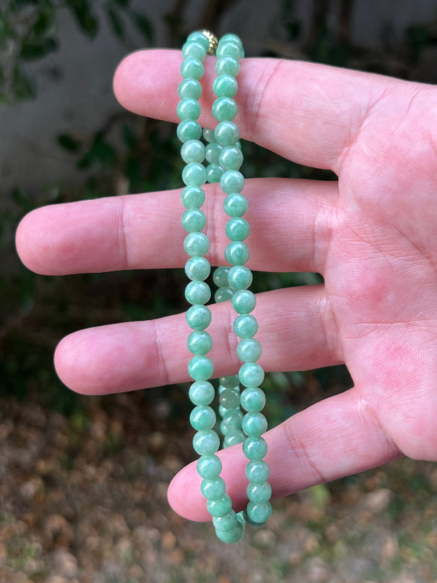 Soft glassy luster and fine crystalline texture of the 6mm authentic Myanmar jadeite bead necklace JN084