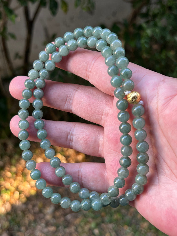 Soft glassy luster and fine crystalline texture of the 7.3mm authentic Myanmar jadeite bead necklace JN089