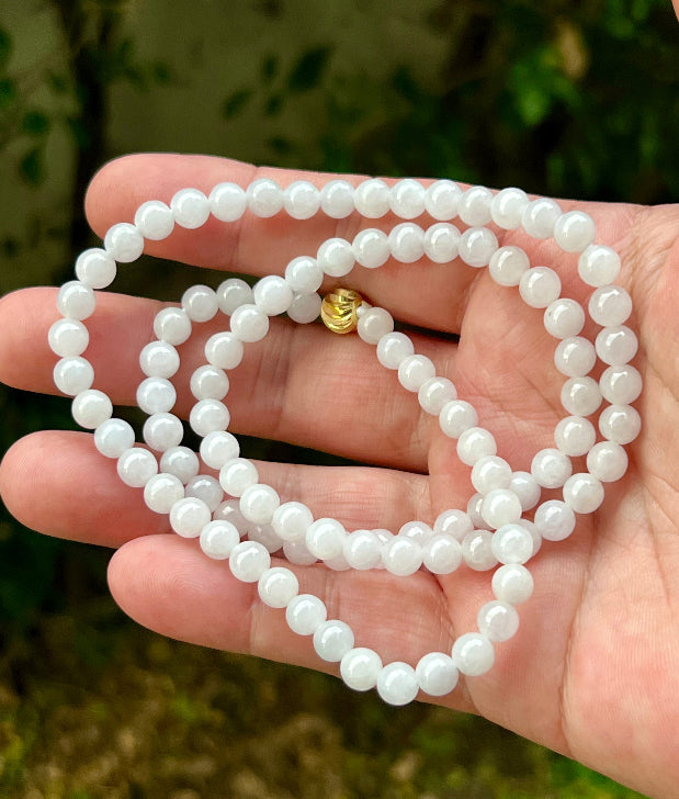 Soft glassy luster and fine crystalline texture of the 6.4mm authentic Myanmar jadeite bead necklace JN014
