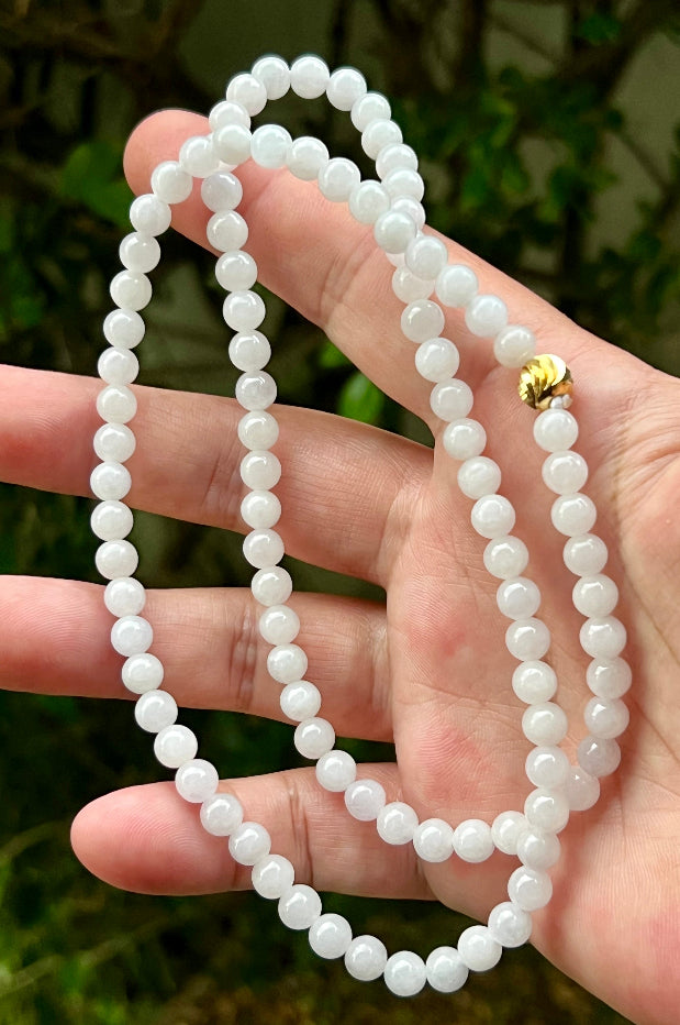 Soft glassy luster and fine crystalline texture of the 6.4mm authentic Myanmar jadeite bead necklace JN014