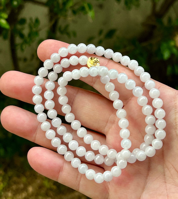 Soft glassy luster and fine crystalline texture of the 6.4mm authentic Myanmar jadeite bead necklace JN014