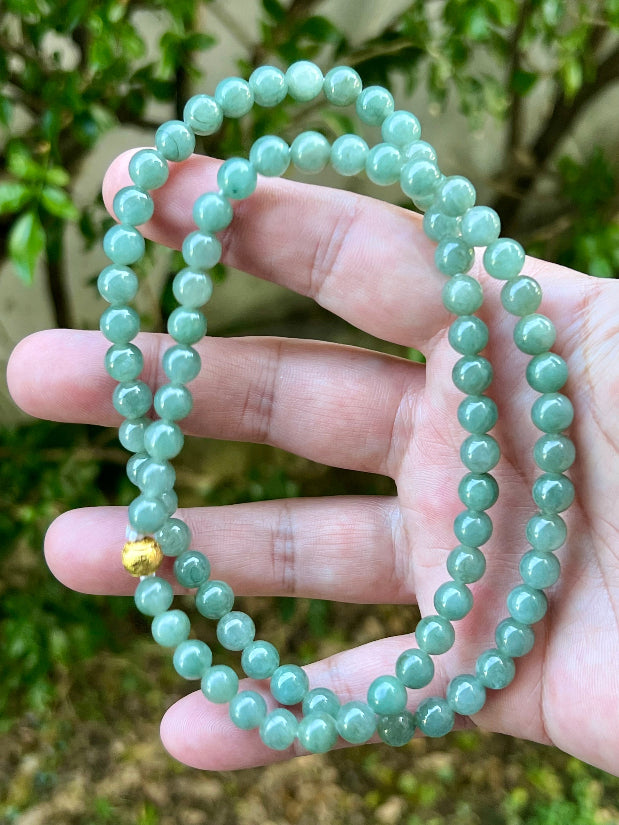 Soft glassy luster and fine crystalline texture of the 7.5mm authentic Myanmar jadeite bead necklace JN019