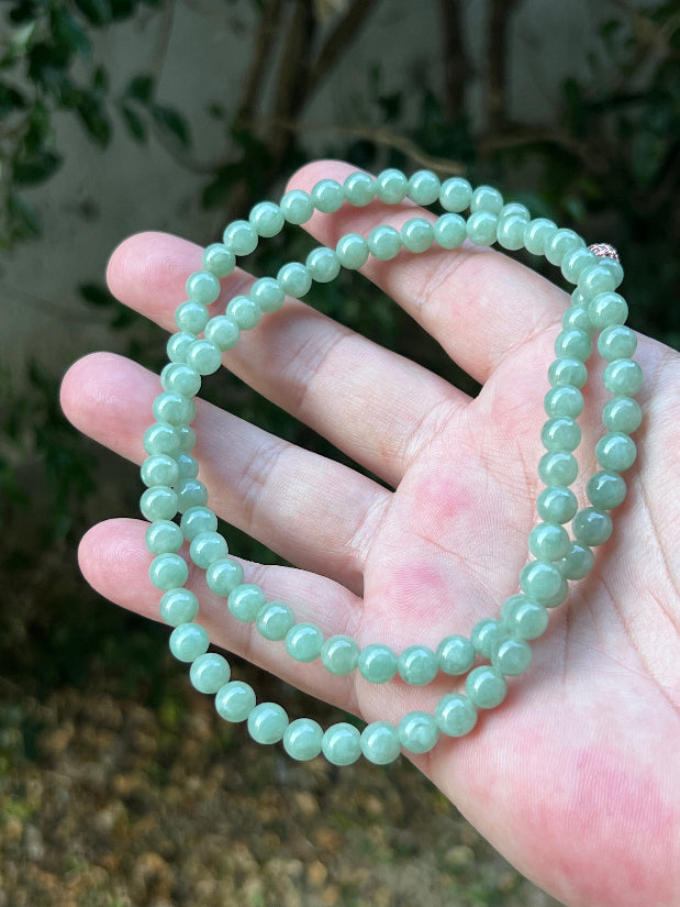 Soft glassy luster and fine crystalline texture of the 6.7mm authentic Myanmar jadeite bead necklace JN079