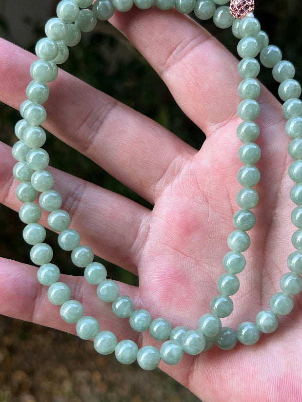 Soft glassy luster and fine crystalline texture of the 6.7mm authentic Myanmar jadeite bead necklace JN079