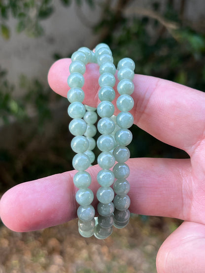 Soft glassy luster and fine crystalline texture of the 6.7mm authentic Myanmar jadeite bead necklace JN079