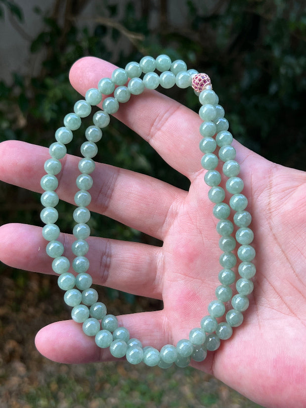 Soft glassy luster and fine crystalline texture of the 6.7mm authentic Myanmar jadeite bead necklace JN080