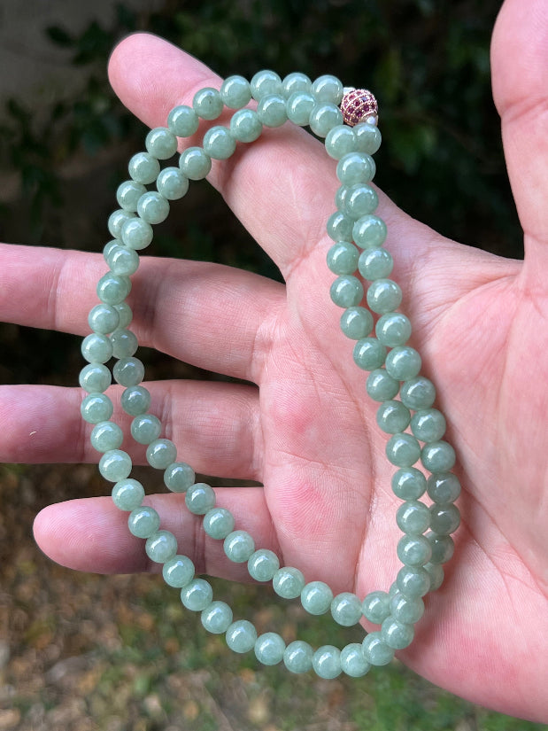 Soft glassy luster and fine crystalline texture of the 6.7mm authentic Myanmar jadeite bead necklace JN080
