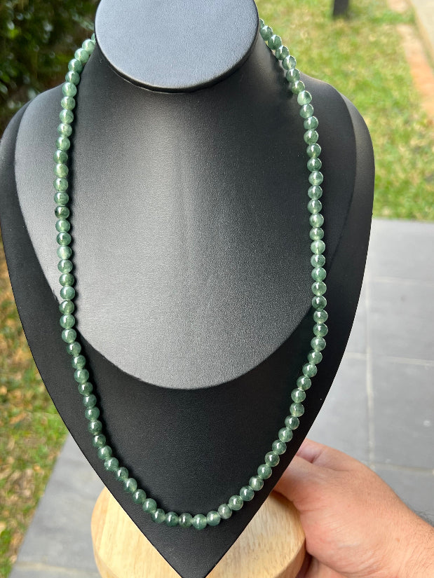 Soft glassy luster and fine crystalline texture of the 6.4mm authentic Myanmar jadeite bead necklace JN092