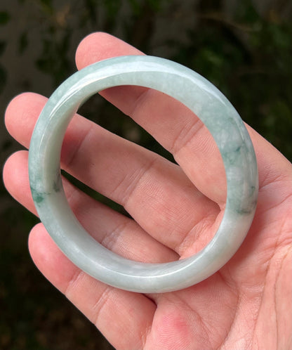 Regular round profile of 58.5mm icy green Burmese jade bangle JB1293