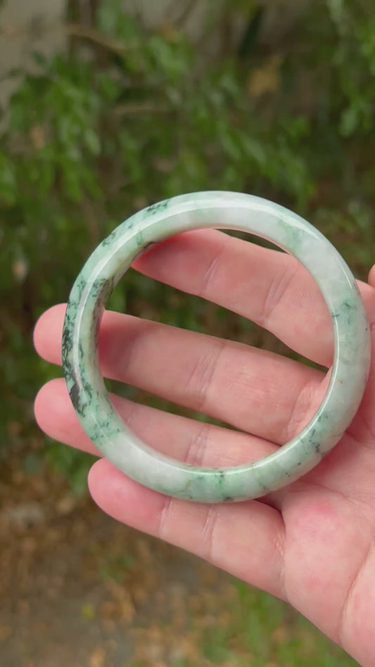 Video showcasing the natural luster and snowflake green patterns of icy Burmese jadeite bangle JB1302
