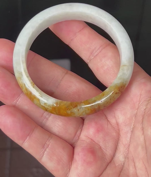 Video showcasing the natural glassy luster and fine crystalline texture of icy greyish white and orange red Burmese jadeite bangle JB531