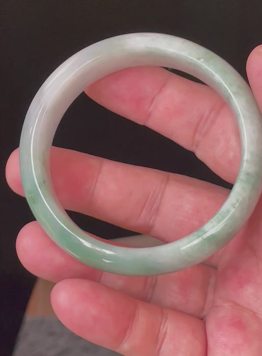 Video showcasing the bright glassy luster and fine crystalline texture of icy imperial green and greyish milky white Burmese jadeite bangle JB004