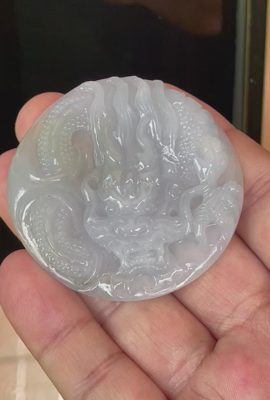 Video showcasing the smooth polished luster, icy lavender and moss green hues, and hand-carved Dragon motif of the certified Burmese jade pendant JP051
