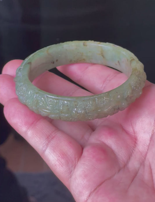 Video showcasing the matte-glossy luster and beautiful icy apple green hue of the 58.3mm hand-carved floral Burmese jade bangle JB211