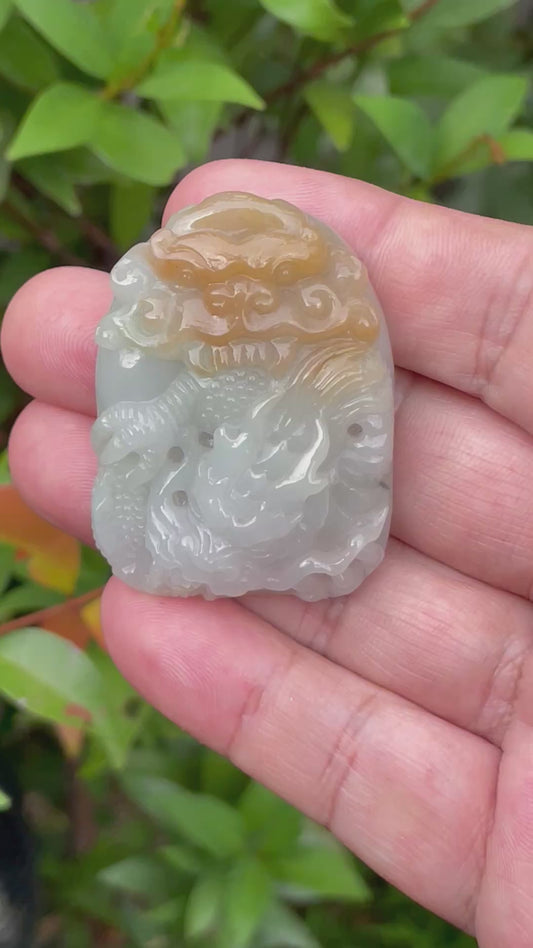 Video showcasing the smooth polished luster, icy honey and imperial green hues, and hand-carved Dragon motif of the certified Burmese jade pendant JP064