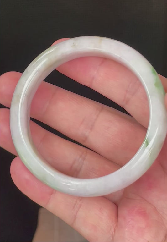 Video showcasing the bright glassy luster and fine crystalline texture of icy imperial green, moss green, and greyish milky white Burmese jadeite bangle JB031
