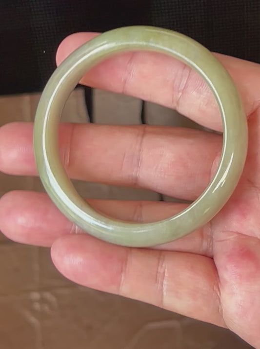 Video showcasing the natural glassy luster and fine crystalline texture of icy apple green Burmese jadeite bangle JB507