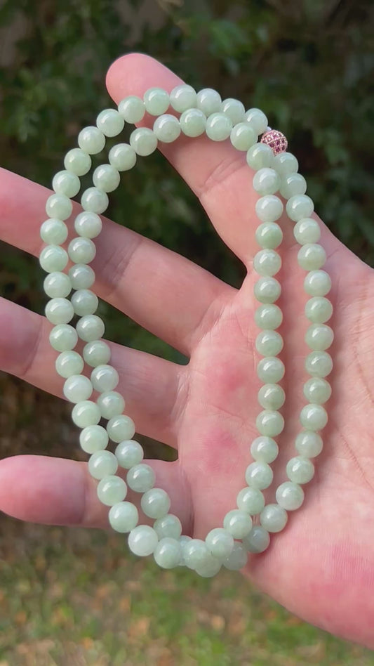 Video showcasing the soft glassy luster and elegant icy imperial and apple green color palette of the 7.5mm certified Burmese jade bead necklace JN081