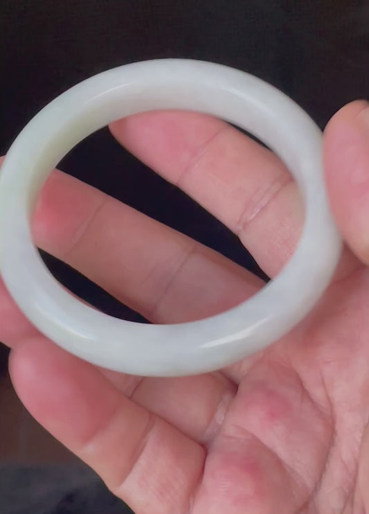 Video showcasing the bright glassy luster and fine crystalline texture of icy greyish milky white and apple green Burmese jadeite bangle JB910