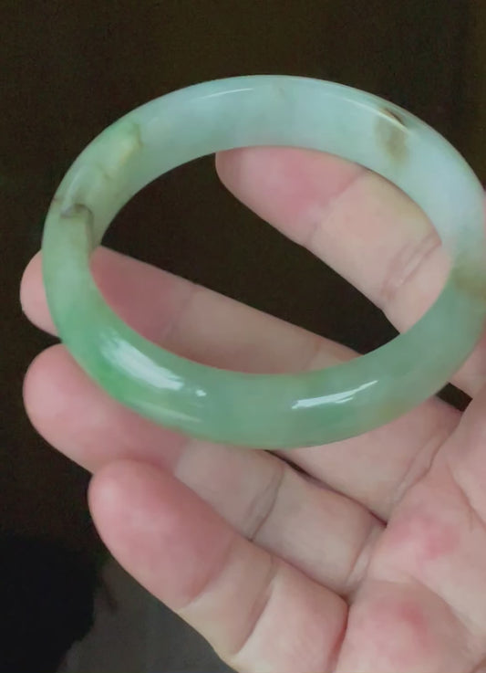Video showcasing the bright glassy luster and fine crystalline texture of icy bluish milky white, green, and honey Burmese jadeite bangle JB120