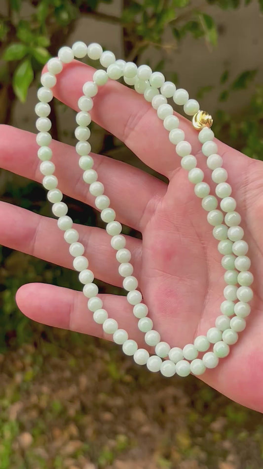 Video showcasing the soft glassy luster and elegant icy imperial white and apple green color palette of the 6mm certified Burmese jade bead necklace JN006