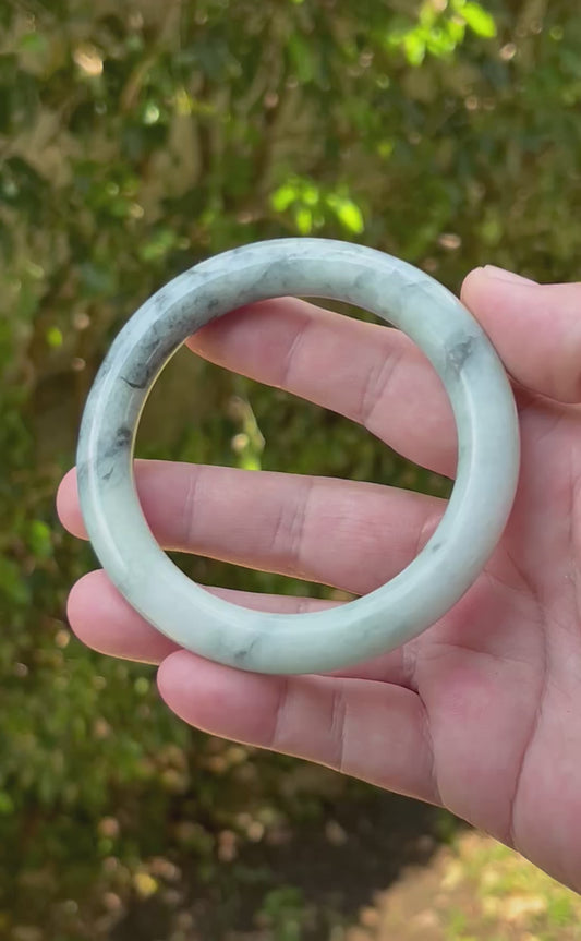 Video showcasing the natural glassy luster and moss green marbling of icy celadon Burmese jadeite bangle JB1272