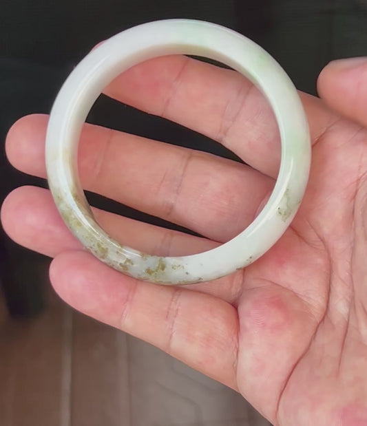 Video showcasing the natural glassy luster and fine crystalline texture of icy milky white and imperial green Burmese jadeite bangle JB527
