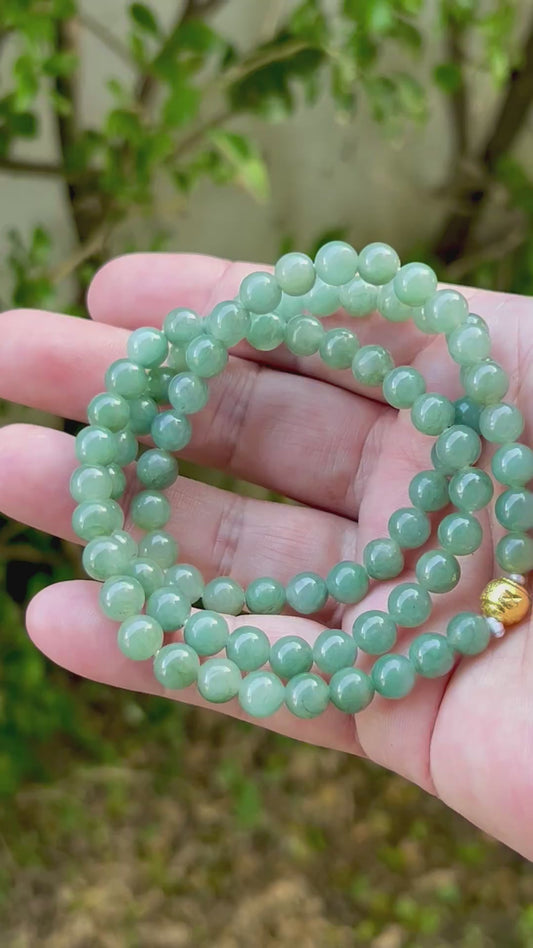 Video showcasing the soft glassy luster and elegant icy imperial green and apple green color palette of the 7.5mm certified Burmese jade bead necklace JN021