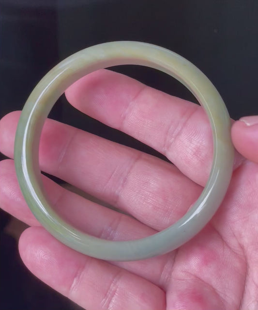 Video showcasing the natural glassy luster and fine crystalline texture of icy apple green, bluish milky white, and honey Burmese jadeite bangle JB213