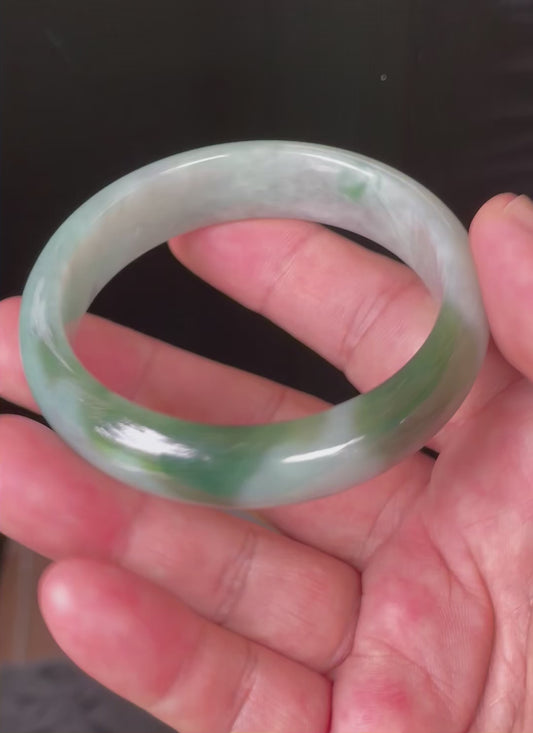 Video showcasing the bright glassy luster and fine crystalline texture of icy greyish milky white and apple green Burmese jadeite bangle JB039