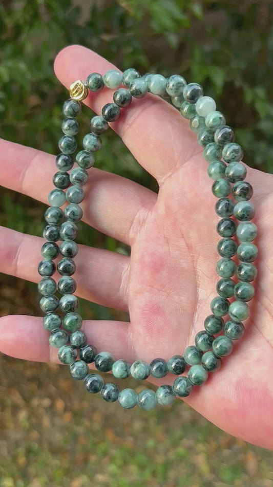 Video showcasing the soft glassy luster and elegant icy imperial and apple green color palette of the 7.2mm certified Burmese jade bead necklace JN086