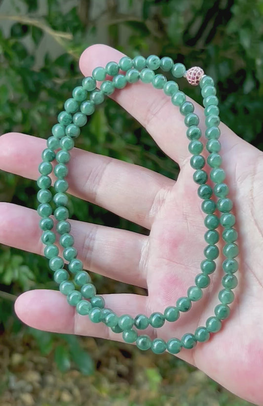 Video showcasing the soft glassy luster and elegant icy imperial and apple green color palette of the 6.2mm certified Burmese jade bead necklace JN074