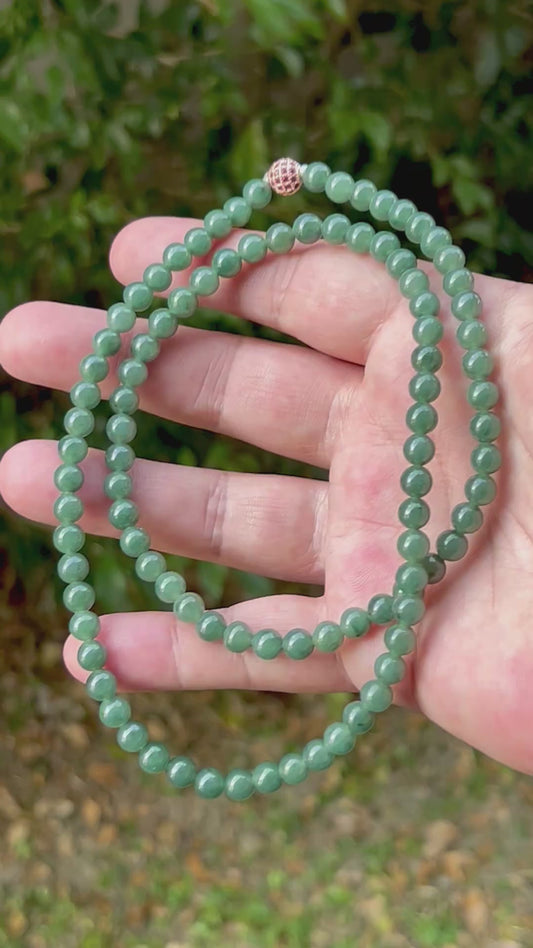 Video showcasing the soft glassy luster and elegant icy imperial and apple green color palette of the 6.2mm certified Burmese jade bead necklace JN073