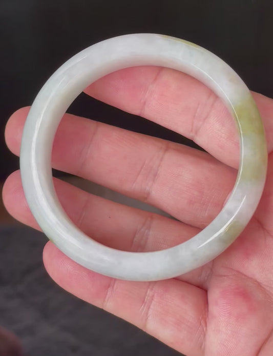 Video showcasing the vitreous luster and fine crystalline texture of icy greyish milky white, apple green, and forest green Burmese jadeite bangle JB851