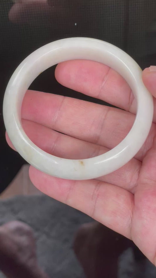 Video showcasing the vitreous luster and fine crystalline texture of icy milky white, light yellow, and soft honey Burmese jadeite bangle JB805