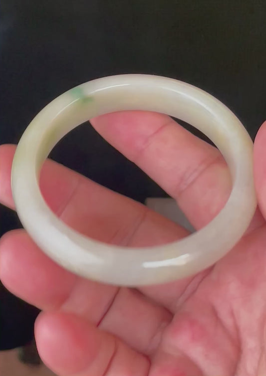 Video showcasing the bright glassy luster and fine crystalline texture of icy yellow, milky white, and imperial green Burmese jadeite bangle JB109