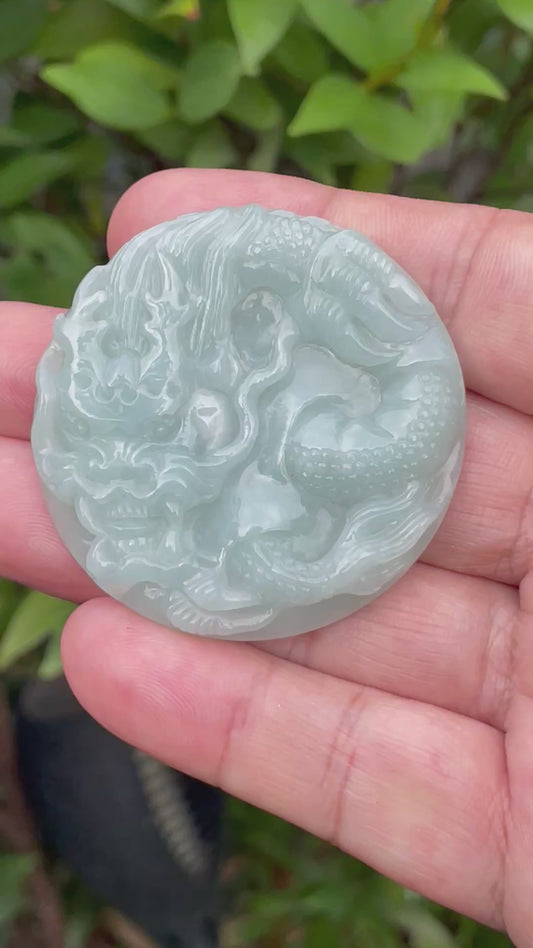 Video showcasing the smooth polished luster, icy imperial green hues, and hand-carved Dragon motif of the certified Burmese jade pendant JP052