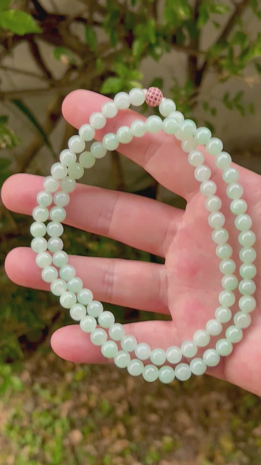 Video showcasing the soft glassy luster and elegant icy imperial white and apple green color palette of the 7.1mm certified Burmese jade bead necklace JN007