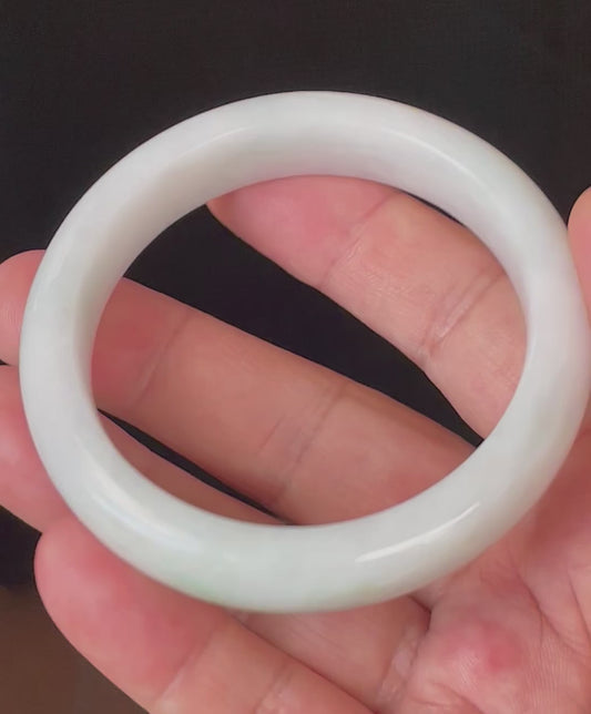 Video showcasing the bright glassy luster and fine crystalline texture of icy milky white and apple green Burmese jadeite bangle JB921