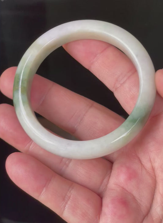 Video showcasing the natural glassy luster and fine crystalline texture of icy milky white, light lavender, and green Burmese jadeite bangle JB215