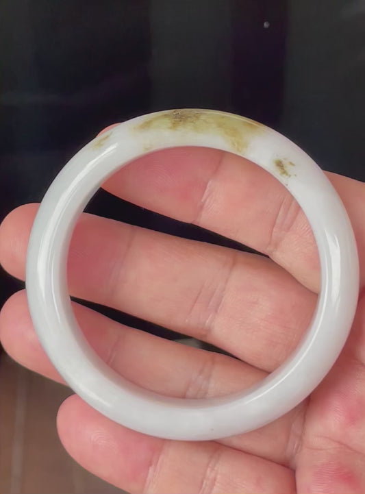 Video showcasing the natural glassy luster and fine crystalline texture of icy milky white, apple green and honey Burmese jadeite bangle JB354